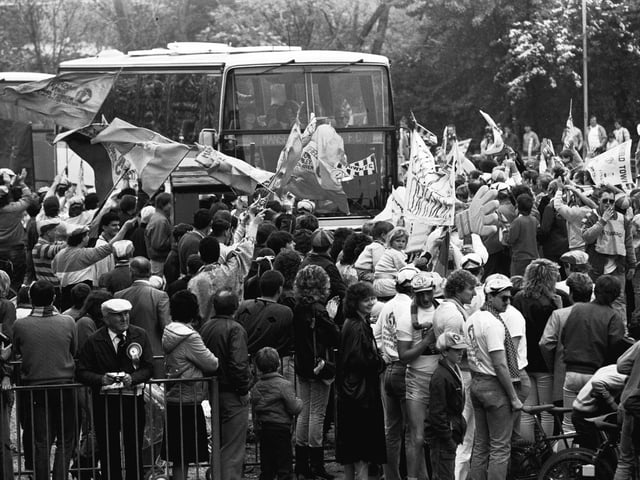 Do you recognise any of the flag-waving fans in this picture?