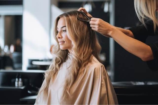 A generic photo of a hair stylist at work.