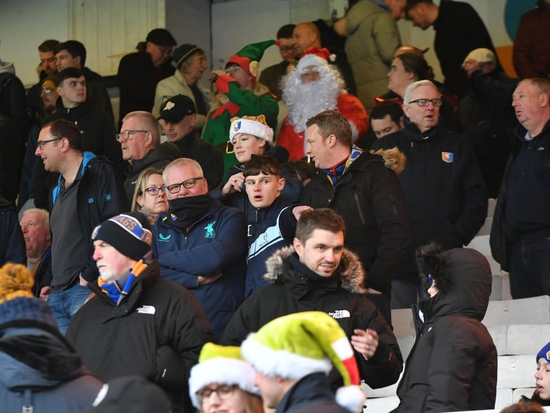 Mansfield Town fans watch the brilliant win at Peterborough United.