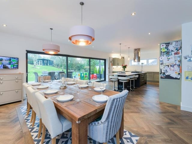 The dining kitchen on the first floor includes bi-folding doors that open out on to a decked seating area and garden at the back of the property.