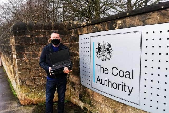 Gary Jordan, Chair of Mansfield & Ashfield 2020 business group, with a donated laptop set to help a school child in the Mansfield area
