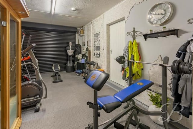 The property's integral garage is currently working well as a home gym with sauna. Access is via a remote-controlled, electric roller-door, and the room has its own power points, plus a window to the side.