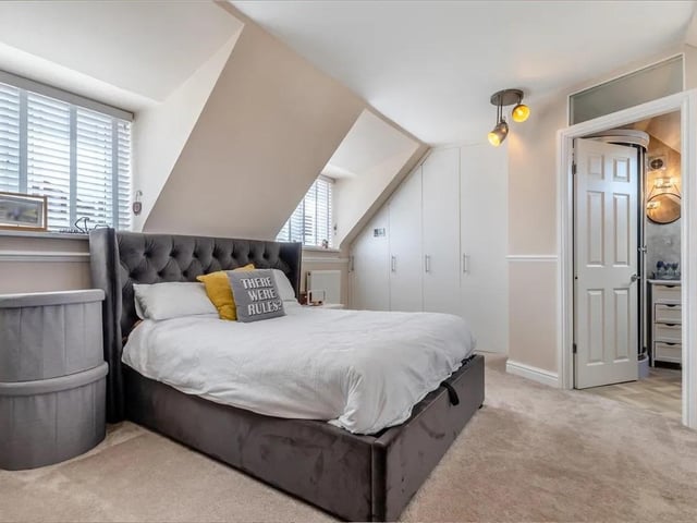 This bedroom benefits from a luxury ensuite.
