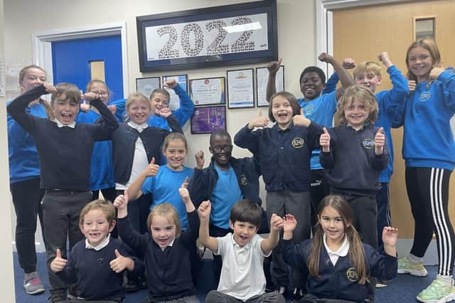 Children at Kimberley Primary School celebrate the school's recent good Ofsted report.
