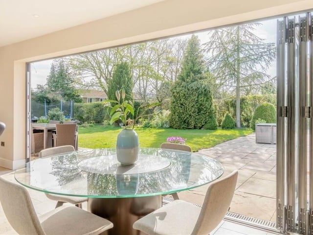 Here is the dining area of the open-plan kitchen. It is a delightful space, complete with views of the attractive back garden via bi-fold doors.