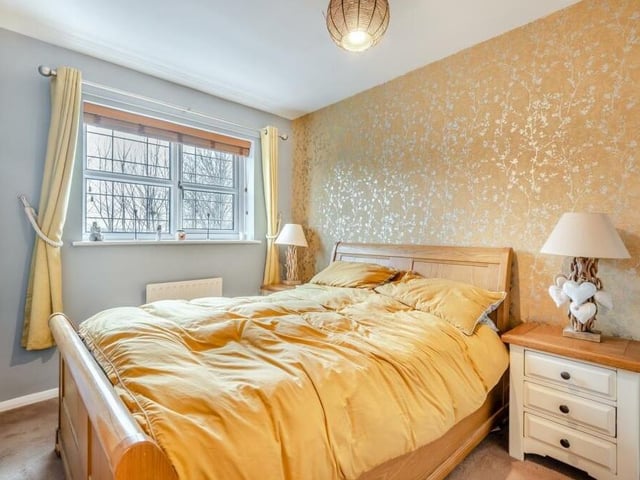 Time to go upstairs now to check out the bedrooms, beginning with the master, which overlooks the back garden. It boasts fitted wardrobes, with hanging rails and shelving, and has access to an en suite shower room.