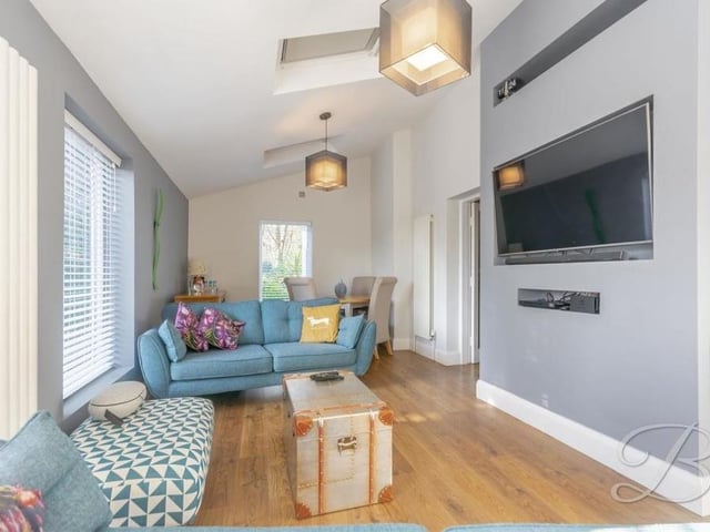 The living room is the property's second reception room. It is a bright and sublime space which features triple aspect windows, oak flooring, vertical radiators and three skylights.