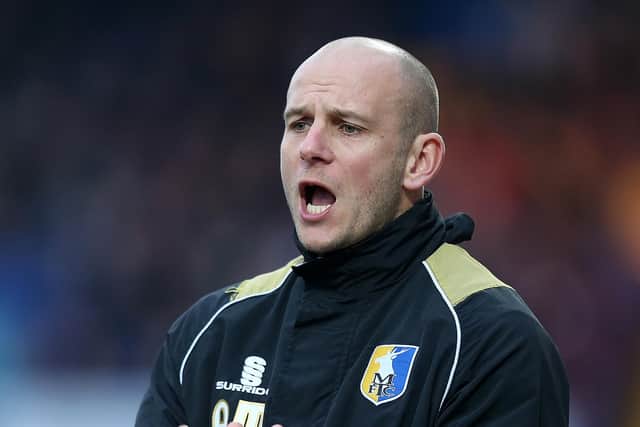 Mansfield Town manager Adam Murray encourages his side during a 1-1 draw with Northampton Town in February 2015.  (Photo by Pete Norton/Getty Images)