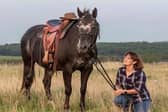 Business owner Kaye Weaver with one of her four therapy horses at Trotting To Happiness in Kirkby. (PHOTO BY: Trotting To Happiness)
