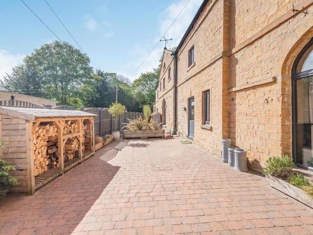 The garden even features a log store