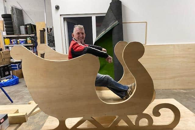 Stan Hammond in the sleigh as it was being built by himself and Mark Watson.