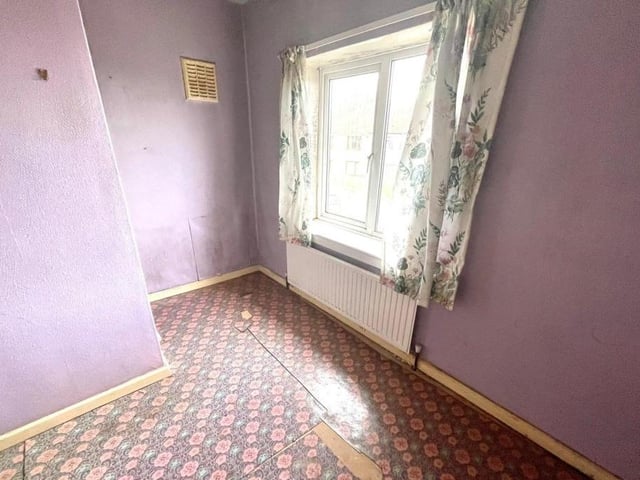 Moving upstairs now, and here is the first of three bedrooms. They are all a decent size,