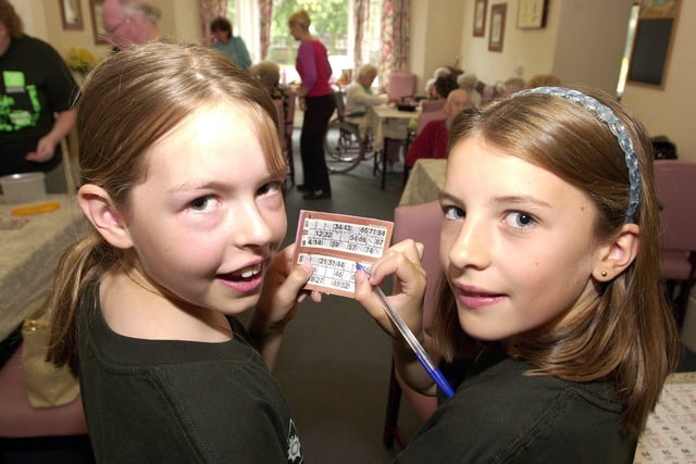 Ten-year-old youngsters  Amy Drury (left), of Branton, and Emily Cattrall, of Auckley, pictured at their fund-raising coffee morning at in 2001