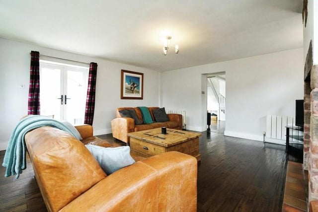 The stunning and spacious lounge also contains patio doors opening out to the garden.