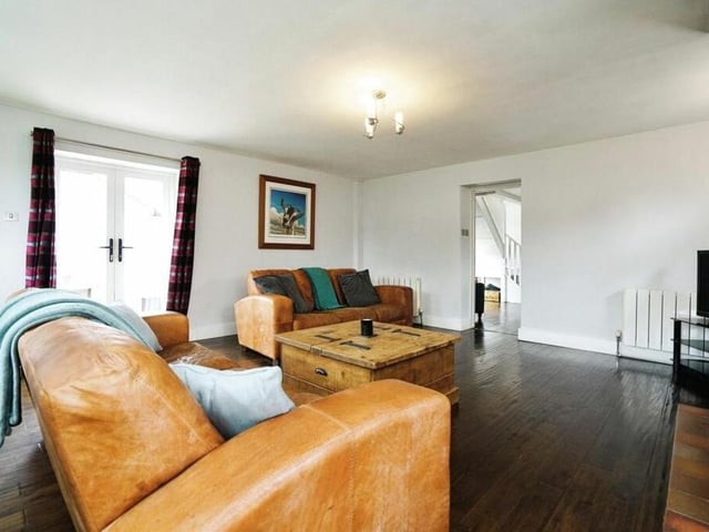 The stunning and spacious lounge also contains patio doors opening out to the garden.