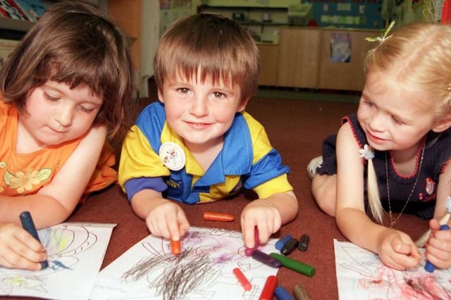 Colouring fun at Doncaster central library, 1999. Charlotte Hicks, aged three from Kirk Sandall with friends Joe and Olivia.
