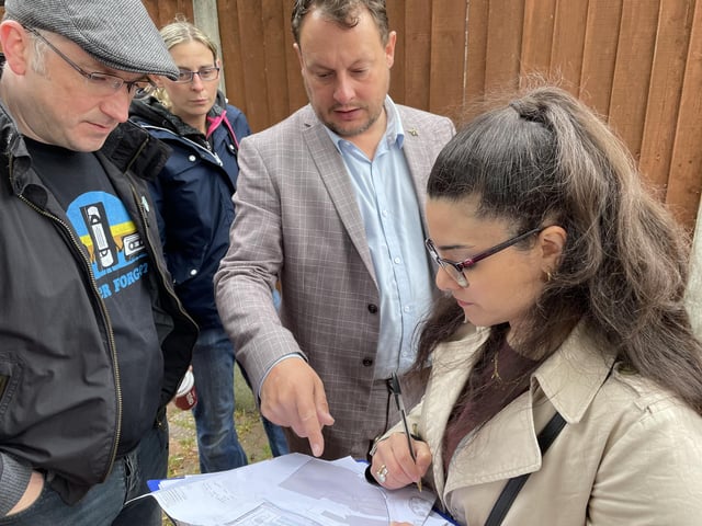 Councillors Matthew Relf, Helen-Ann Smith and Jason Zadrozny look at the plans for Sutton town centre