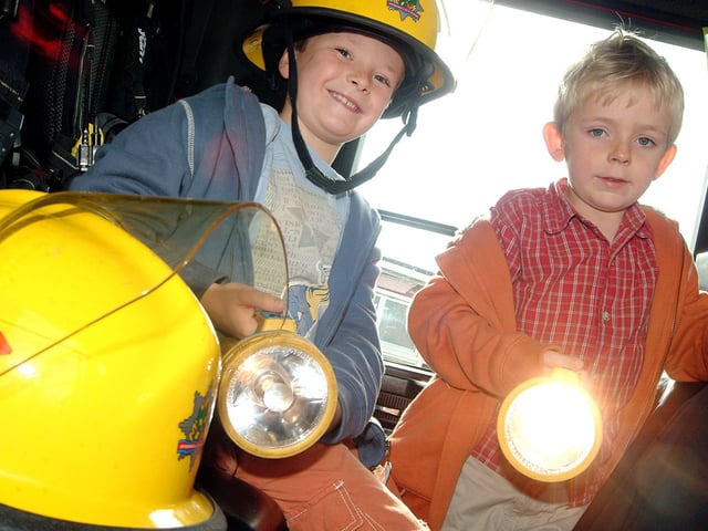 Mansfield Woodhouse mardi gras. Here are brothers Ben and Elliot Harrison, navigating their way around a visiting fire engine.
