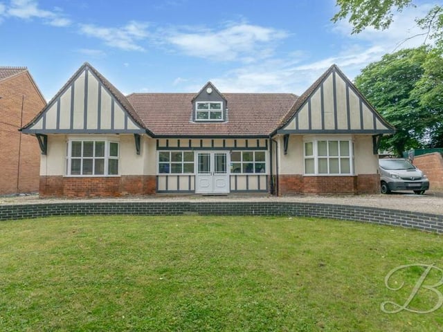 Back to the front of the £645,000 bungalow, where an extensive lawn distinguishes the garden.