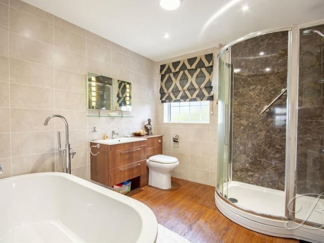 The last room to look at is this attractive family bathroom. It comes complete with a free-standing bath, enclosed shower, wash hand basin, low-flush WC, full-height tiling and downlights.