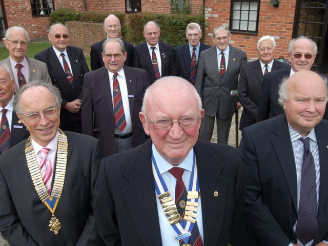 Barton Somerset, centre, President of Mansfield Woodhouse Rotary Club, pictured with Andrew Campin, front left, President of Mansfield Rotary Club,  Rtn Clive Joll, front right, committee members and founder members at the club's 21st anniversary celebration held at Red Brick House in 2007.