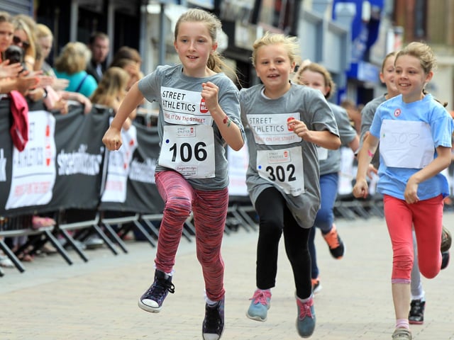 Parents watch on as these youngsters enjoy a race.