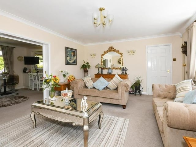 There is only one place to start our tour of the Chatsworth Drive bungalow, and that's in the lounge, which has more than a touch of luxury about it. The room includes a gas fire with surround, carpeted floor and uPVC double-glazed window facing the front of the property.