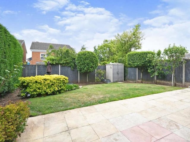 We conclude our tour of the property with a look at the neat and tidy garden. Mainly laid to lawn, it also features a large patio, decking and a shed.