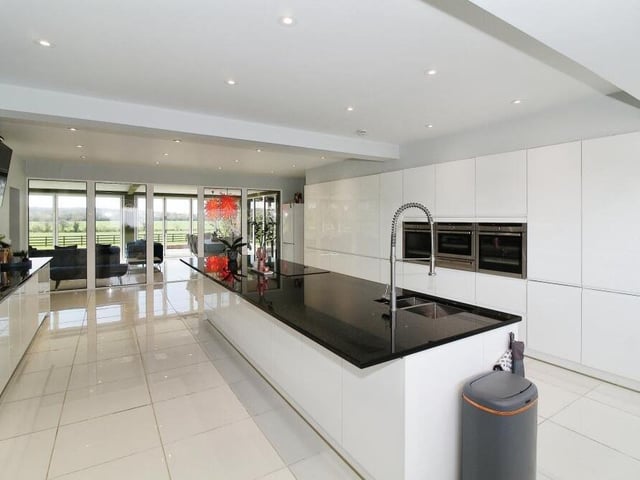 Among the range of integrated appliances in the kitchen are three ovens, including a microwave. Budding chefs will be in their element.