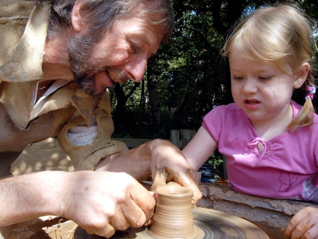 Kelsey Leach gets her hands dirty on the potters wheel at the Robin Hood Festival in 2007.