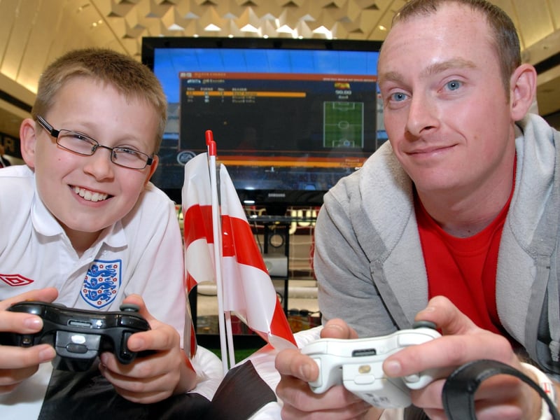 Mansfield's Four Seasons Shopping Centre hosted a World Cup Fifa Video Game Challenge to mark Father's Day. Pictured is Daniel Wilkinson, left who beat his dad's friend Daniel Clark 3-0 in the challenge. 2010.