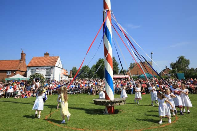 The event is centred around the village's spectacular 17 metres high painted maypole on the village green.