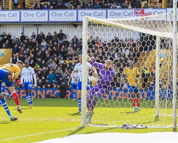 Mansfield Town defender Baily Cargill sees his header superby saved during Saturday's 1-1 home draw against Colchester United. Photo by Chris & Jeanette Holloway/The Bigger Picture.media