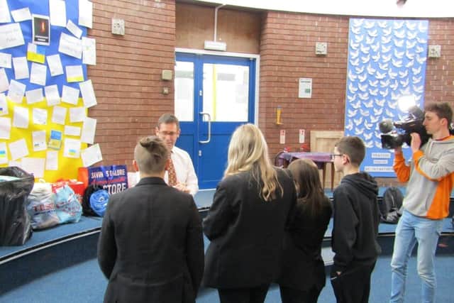 Mayor of Mansfield Andy Abrahams and a film crew from ITV Central visited All Saints Catholic Academy School to meet pupils who organised a collection for Ukraine