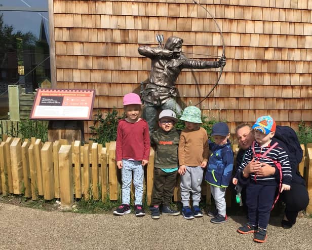 Children by the Robin Hood statue at the Sherwood Forest Visitor Centre.