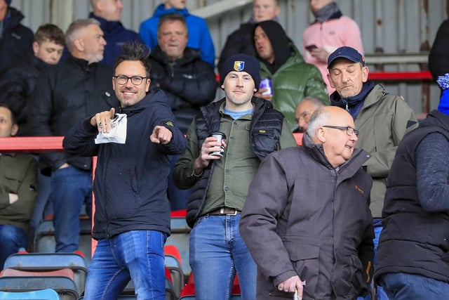 Mansfield Town fans watch the defeat at Wrexham.
