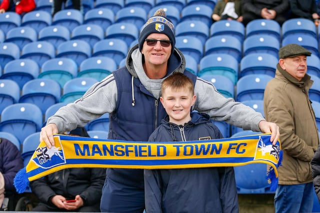 Mansfield Town fans watch the match against Northampton Town.