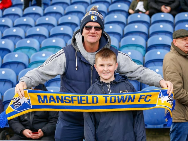 Mansfield Town fans watch the match against Northampton Town.