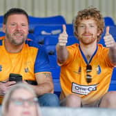 Mansfield Town fans enjoy the win at Oldham.