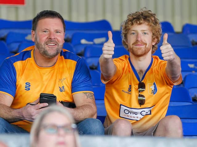 Mansfield Town fans enjoy the win at Oldham.
