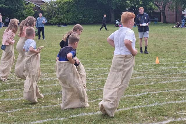 Children took part in traditional races at the event, including a sack race.