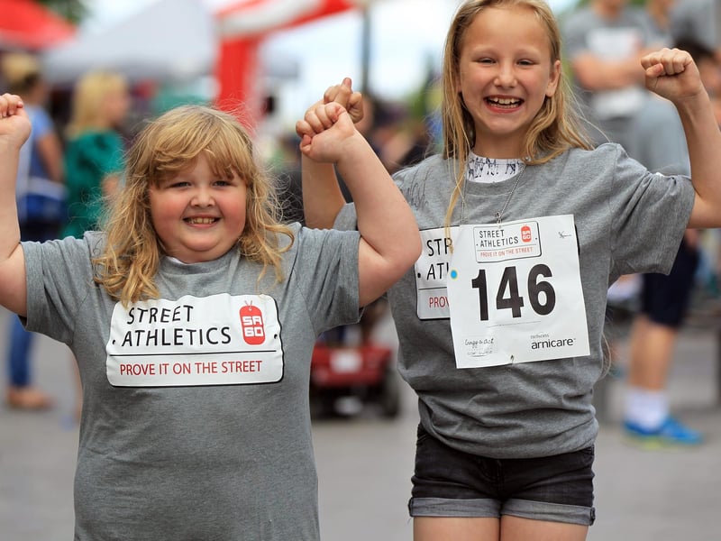 Aimee Burchell, nine, and Ashleigh Fletcher, six, celebrate a successful day.