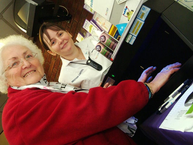 Infection control staff at Kings Mill Hospital gave a hygiene demo using a 'glow and tell' lightbox. The equipment shows if hands have been washed properly or not. Testing the equipment is retired carer and charity worker Mo Bowles from Bilsthorpe with Deborah Hamilton, Clinical Specialist in Infection Control. 2007.