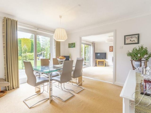 The dining room is a delightful spot for family meals, in front of sliding doors that lead out to the back garden. It has fitted carpets and open access to both the lounge and the kitchen.