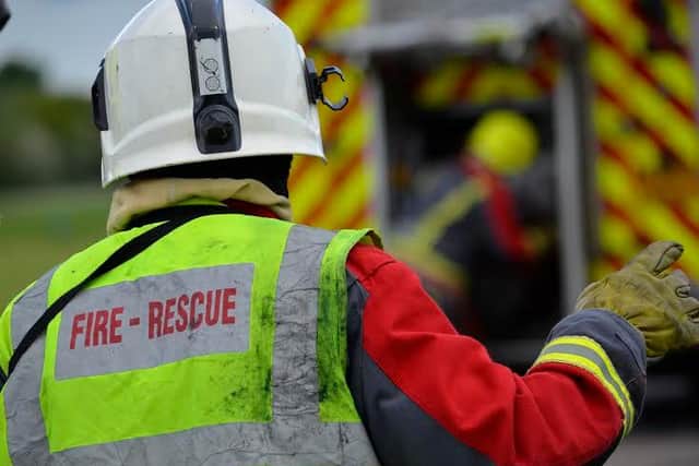 A woman was pulled to safety from a house fire in Kirkby on Sunday evening.
