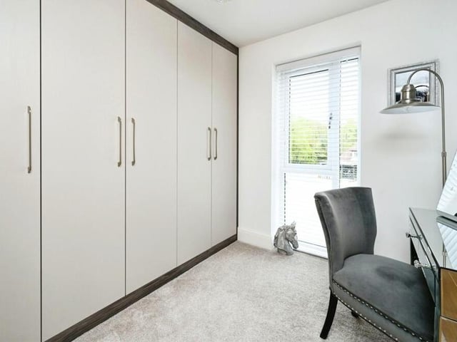 Built-in wardrobes are a feature of the fourth and final bedroom, which has a full-length window facing the front of the Rockcliffe Grange property.,