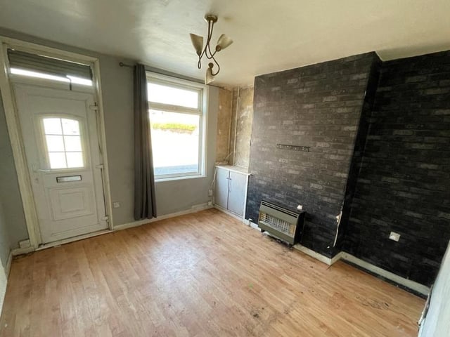 As you step through the front door at the Alfred Street property, you are greeted by the main room on the ground floor, this compact lounge.