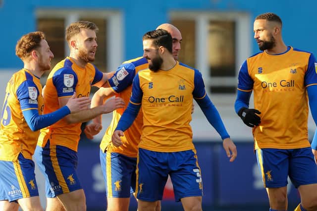 Stags celebrate defender Stephen McLaughlin's first half goal in Saturday's 3-1 victory at Barrow. Photo by: Chris Holloway/The Bigger Picture.media.