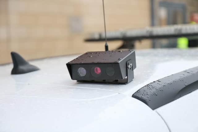 The automatic number plate recognition camera is mounted on the roof the vehicle.