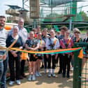 Nottinghamshire County Council chairman, Councillor Richard Butler, cuts the ribbon at Adventures.
